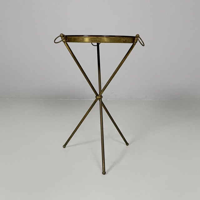 Italian mid-century modern coffee table in brass and wood top with portrait, 1950s Brass and wood coffee table with a...