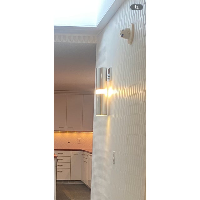 Mid Century Modern wall sconce: Chrome metal finish, meant to be hardwired installation. Item holds one light bulb with an...