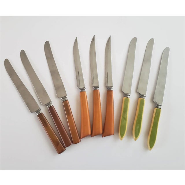 Original Mid-Century Bakelite and stainless steel flatware. A little of this and a little of that...total of 15 pieces: 9...