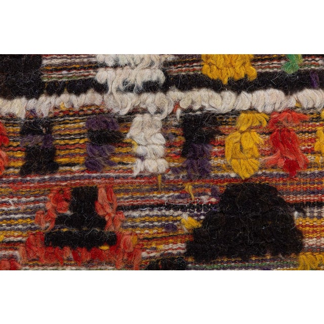 Brimming with artistic vitality, this 1955 Moroccan rug beautifully captures the spirit of mid-century Berber...