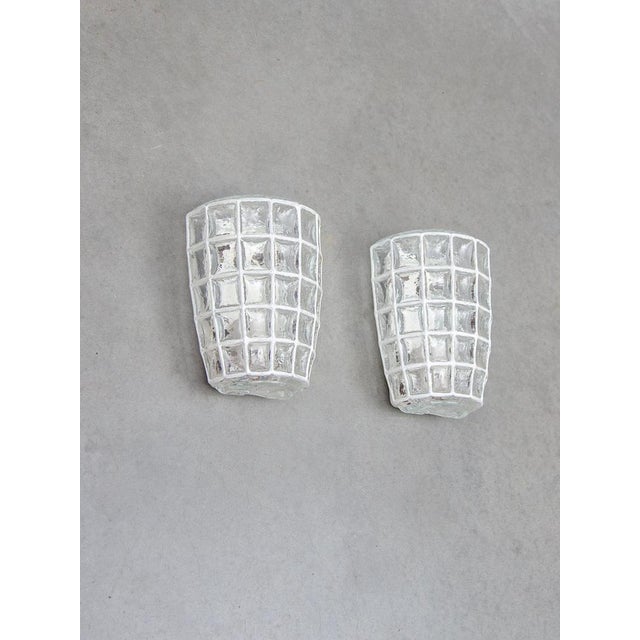 Pair of decorative wall lights with a nice art glass design by Glashütte Limburg, Germany. Manufactured midcentury, 1960s....