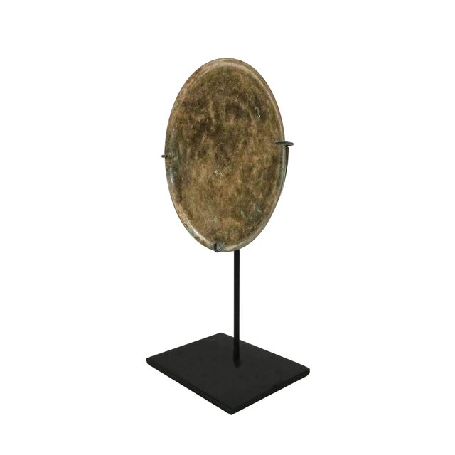 A small bronze mirror from Thailand, circa 13th-15th Century. In Southeast Asia, The Khmer culture existed between the 9th...