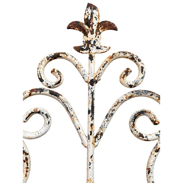Featuring elegant scrolling details, a decorative fleur-de-lis finial, and a gracefully curved lattice basket, this...