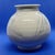 This exceptional wheel- thrown ceramic vessel features a delicate white surface glaze with minor authentic crazing. Theres...