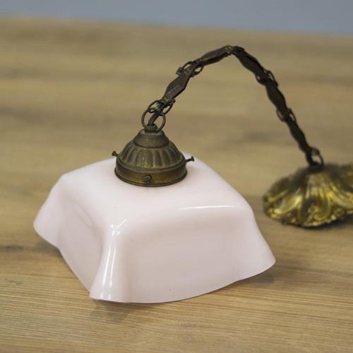 Art-Deco hanging lamp from the 1930s with pink glass shade. The fixture is made of brass. The lamp has new wiring and...