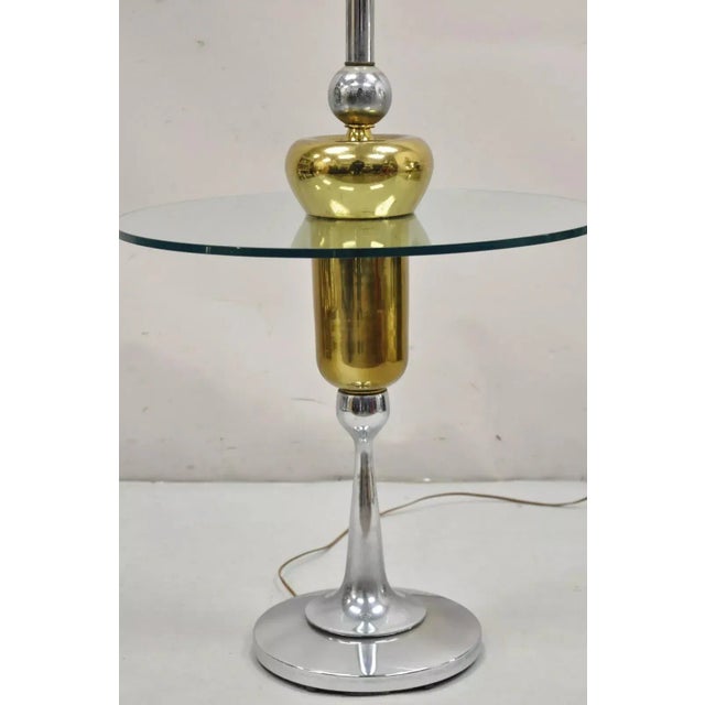 Vintage Mid Century Modern Space Age Atomic Era Chrome Brass & Glass Side Table / Floor Lamp. Circa 1970s. Measurements:...