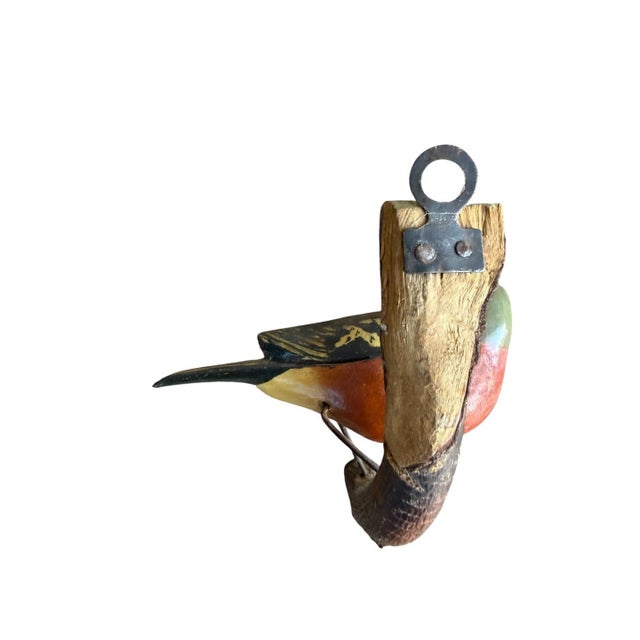 A folk art bird from Austria — hand carved wood. Measures 5.5" x 4" x 2.5". A charming folk-art carving for a shelf,...