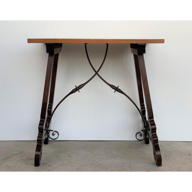 About 19th century Baroque Spanish side table with marquetry top 19th century Spanish trestle table in walnut. This piece...