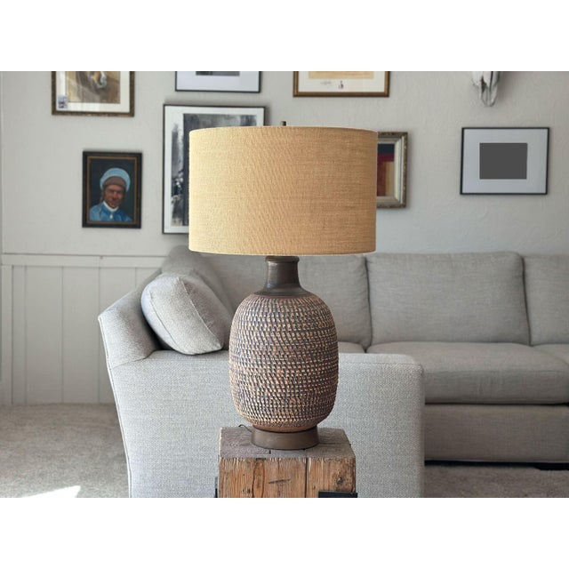 Bring texture into your space with this stunning 1960s Bob Kinzie for Affiliated Craftsmen Studio monumental pottery table...