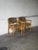 This pair of dining armchairs features a padded backrest and streamlined frame. Their clean profile beautifully reflects...