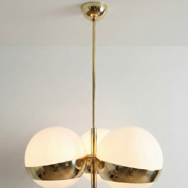This Nest of Three Sphere Lamp is a Stilnovo design, originally from the 1960s. The piece features three white glass...
