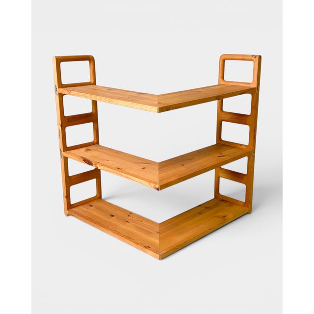 Original corner wall-mounted shelving system designed by Poul Cadovius and manufactured by the Danish company Cado....