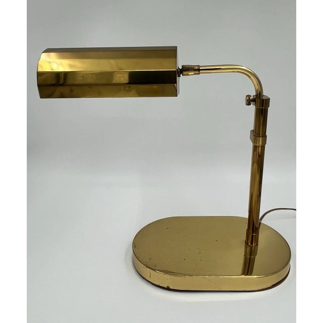 Sculptural Mid Century Modern Adjustable Brass Desk Lamp is reminiscent of retro pharmacy lamps or bankers lamps. This...