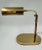 Sculptural Mid Century Modern Adjustable Brass Desk Lamp is reminiscent of retro pharmacy lamps. This lamp is made of...