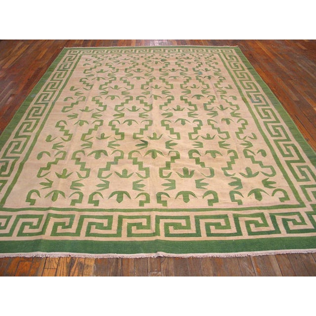 Antique Dhurrie Indian Ivory 1940s Rug, Circa Date: 1940s. This exceptional example of a Dhurrie Indian rug captures the...
