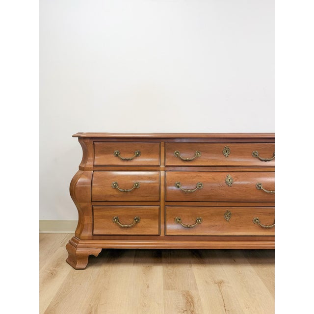 This elegant vintage Century Furniture Provincial 9-drawer dresser is a beautifully crafted and distinctive bedroom find....