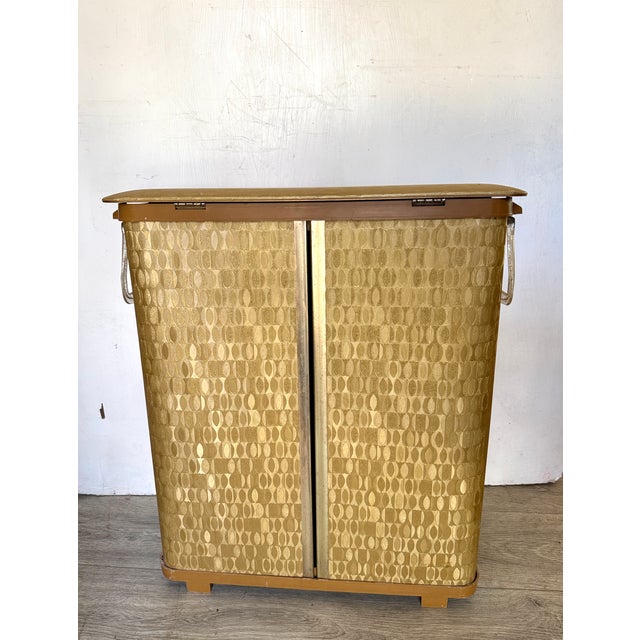 Vintage Detecto mid-century modern clothes hamper in a gold foil vinyl pattern with an atomic starburst accent.Pairs...