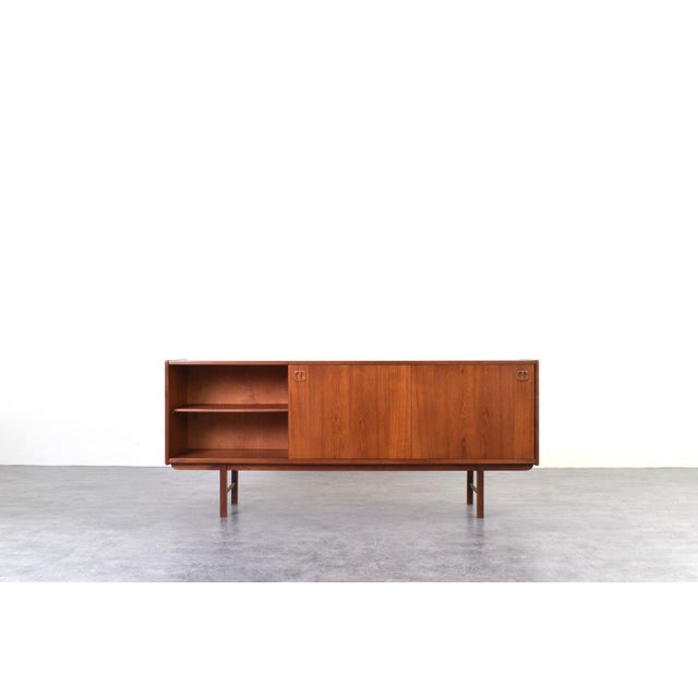 This teak sideboard was designed in the 1960s by Klippan Korsør and manufactured by IKEA. This sideboard has been...