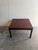 Danish Mid-Century Modern coffee table crafted in richly grained rosewood. This piece features a clean square silhouette...