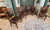 4 side chairs and 2 arm chairs in hardwood solids with cherry veneers. Carved details and hand-applied glaze finish in...