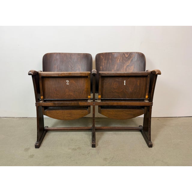 This two-seat cinema bench was produced by Thonet in former Czechoslovakia during the 1940s - 1950s. The bench is stable...