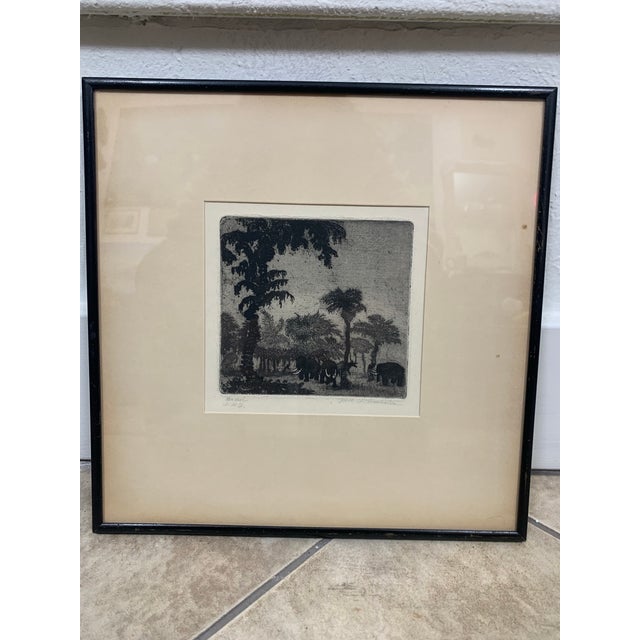 This is an original etching by Fritz Silberbauer created in 1914, depicting a prehistoric scene with mammoths. The artwork...