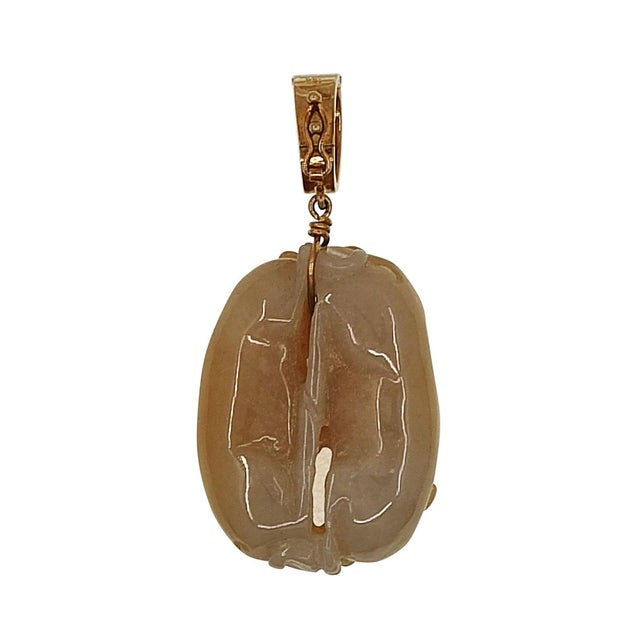 Estate 18K gold yellowish orange carved jade animal pendant enhancer. This estate pendant is crafted in 18 karat yellow...