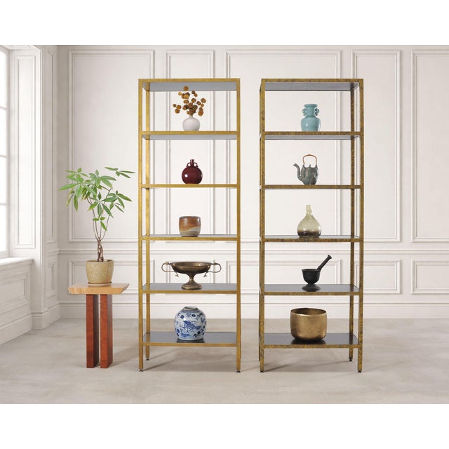 An elegant pair of open étagères or bookshelves constructed out of iron and hardwood by Oly Studio, San Francisco,...
