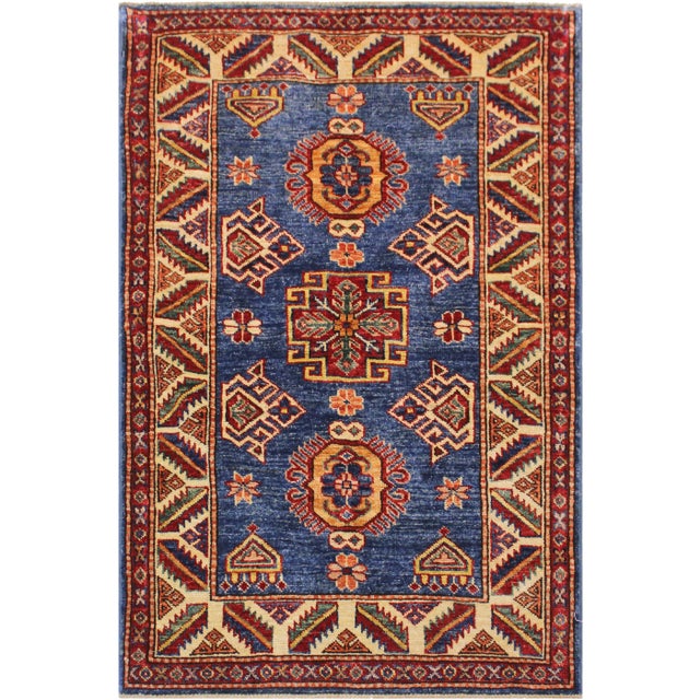 Create a new dimension of style in your home with this breath-taking hand-knotted rug featuring incredible luxurious...