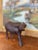 This vintage wooden sculpture depicts a water buffalo, meticulously hand-carved from a single piece of hardwood. The...