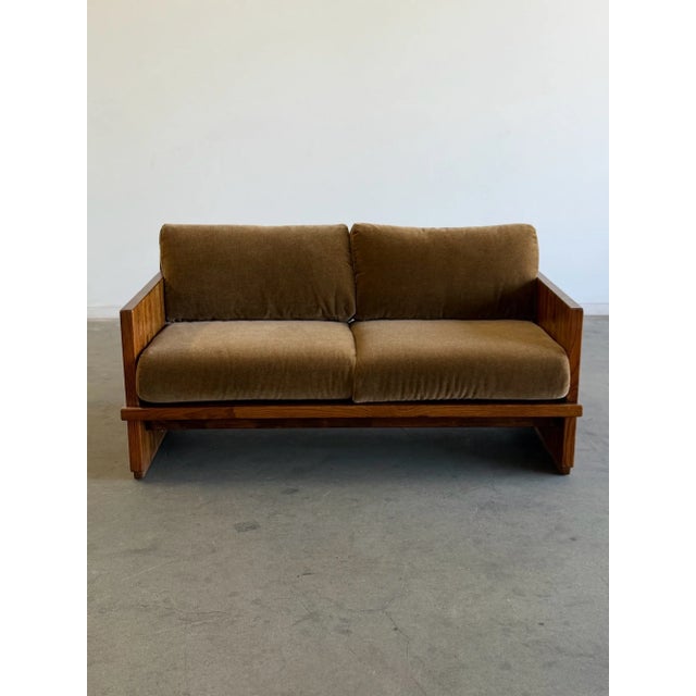 W60 D33.5 H31 SW55.25 SD20 SH18.5 AH23 This solid oak sling loveseat has been refinished and reupholstered in a mohair. It...