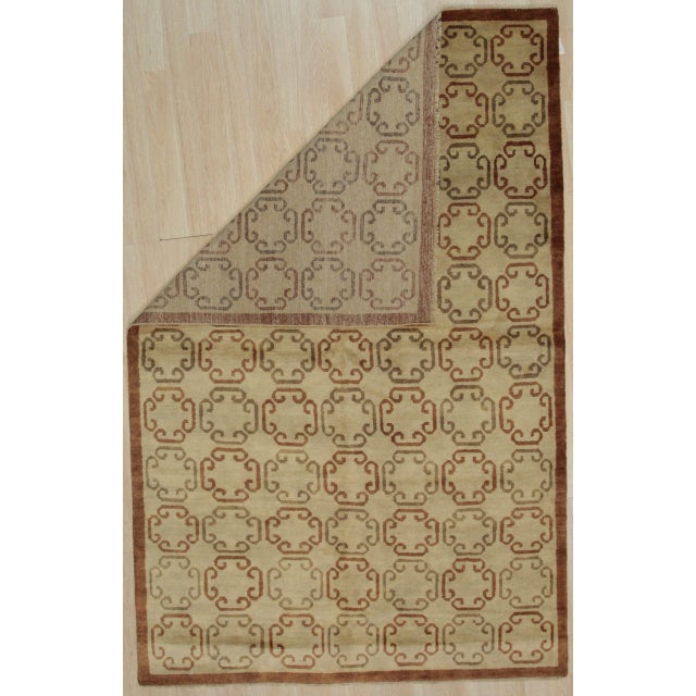 Louie Vibrant Brown Hand Knotted Wool Rug, Country of Origin: China. This elegant piece showcases a sophisticated...