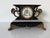 Impressive antique Ansonia “Belgium” mantel clock featuring an ornate architectural design with a black finish, gilt...