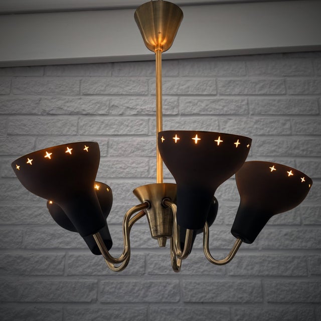 A Scandinavian mid-century chandelier, attributed to the Swedish lighting manufacturer Göteborgs Armaturhantverk, circa...