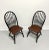 A pair of Windsor dining side chairs, unbranded. Nutwood with back, legs & stretchers painted black, bowback, tapered...