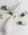 This vintage set of 4 silver-plated napkin rings from the 1960s features a classic ribbed design accented with an elegant...