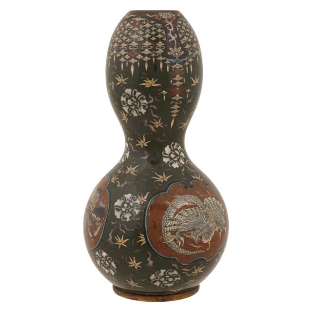 A Japanese Cloisonne enamel vase from the Meiji period (1868–1912), circa 1890. Standing 10 inches tall, the vase has a...