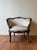 A pair of late 19th-century French Louis XV bergère chairs, finely carved in walnut with floral and rocaille motifs. The...