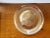 This is a Vintage Jeannette Gold Glass Round Serving Platter. It measures 1 1/8" high and 12 3/4“ in diameter. The piece...