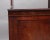 19th Century mahogany cabinet / bookcase, the open top section consisting of a decorative shaped and inlaid cornice and...