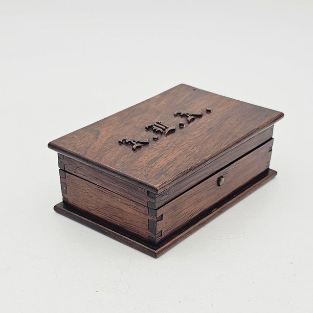 A jewelry box, England circa 1930. The raised initials on the top are stylized Old English or Gothic Script "ALA".
