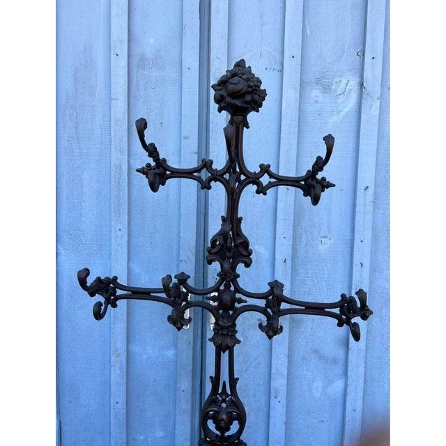 19th Century Antique Victorian cast iron rococo hall tree coat hook umbrella stand. Item features multiple ornate hooks,...