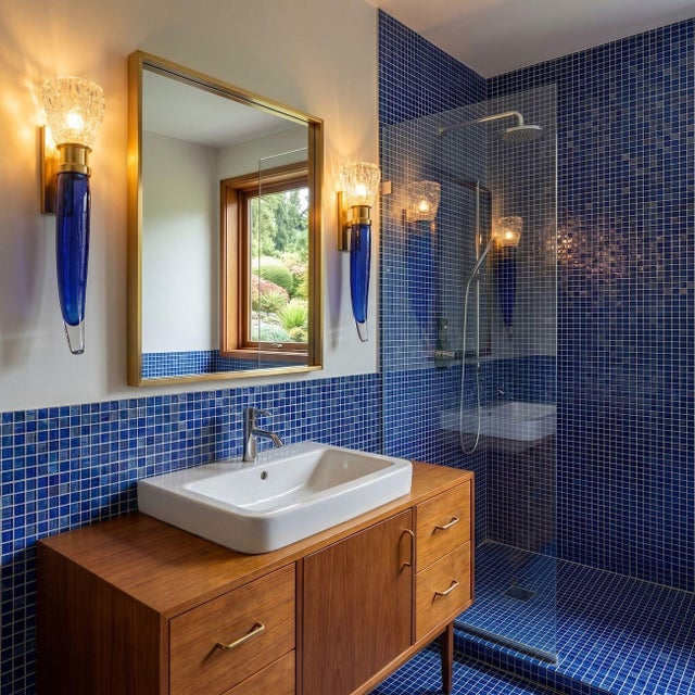 Pair of large Mid-Century Modern Murano glass wall sconces, attributed to Seguso, circa 1970s. The vintage sconces are...