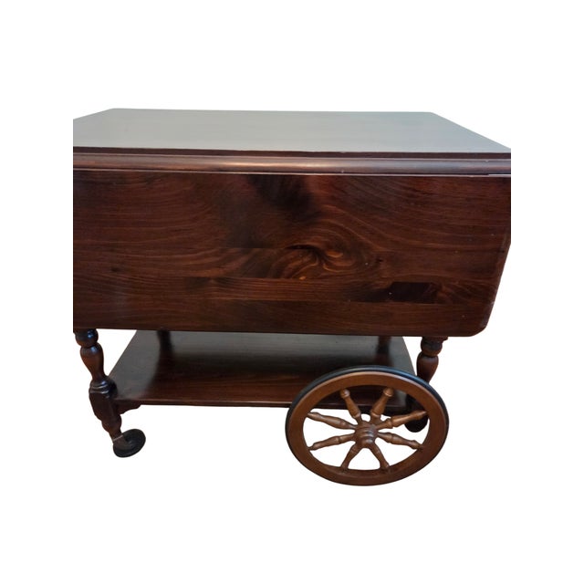 40 inches wide with drop leaves in the up position. Beautiful Ethan Allen tea cart in very nice condition. Minor ware and...