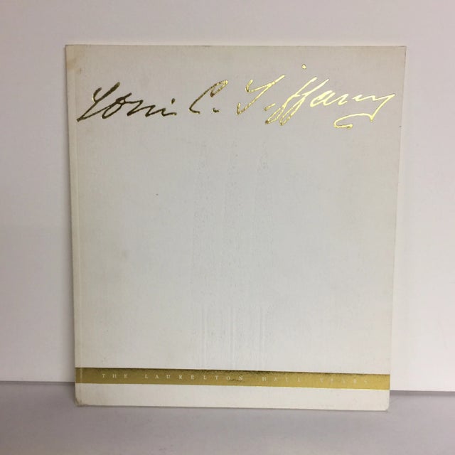 Offered is a soft covered essay by Holly Pinto Savinetti titled Louis Comfort Tiffany: the Laurelton Hall Years. Roslyn,...
