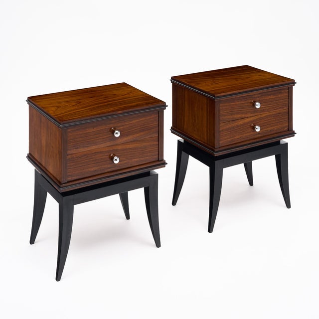 Pair of side tables from period Art Deco France. Each is made of solid wood construction with a flamed mahogany veneer....
