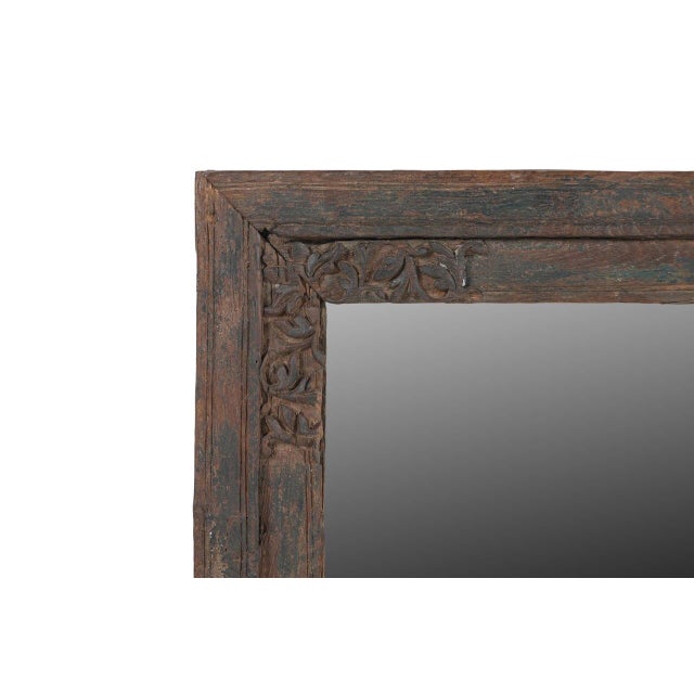 Handcrafted from solid teakwood, the frame features beautiful carvings accented by remnants of its original painted...