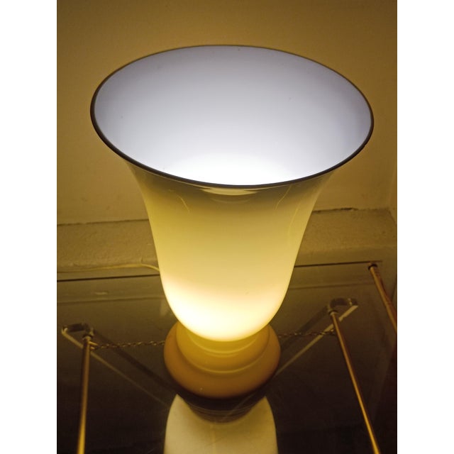 Beautiful 1970s table lamp. Beige opaline glass, which reveals its full splendor when lit. Diffusion of a soft and...