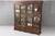 Four door mahogany library bookcase on four drawer base. Circa 1870.