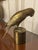 Mid century modern solid brass bird on pedestal. Solid and stately piece. Perfect for your bookshelf or table.